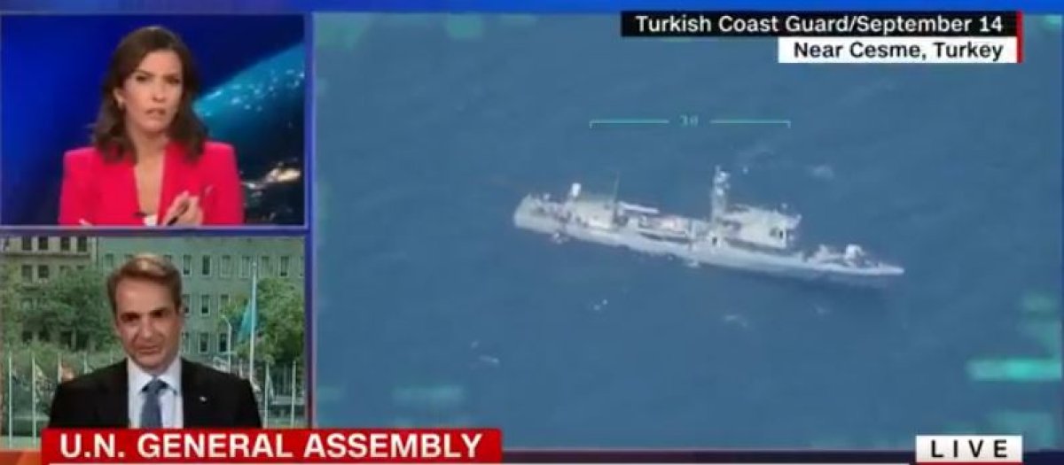 CNN, Kiryakos Miçotakis konuşurken geri itilen göçmenleri gösterdi #1